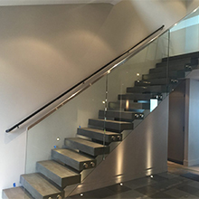  Glass balcony railing with stainless steel top and bottom rail 