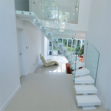 Interior curved stair with stainless steel stringer glass railing