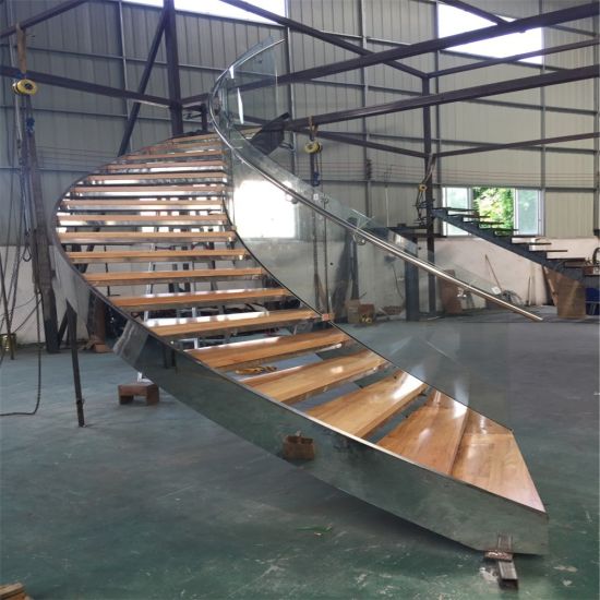 J- curved stairs with stainless steel stringer and glass railing 